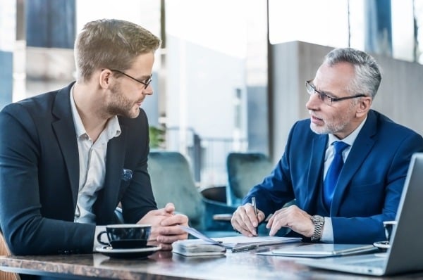 Business men reviewing information