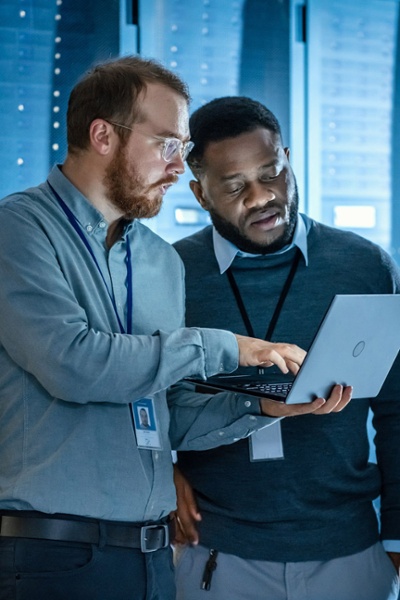 Colleagues working together on laptop