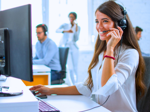 A Female Help Desk agent assists an end user through a technical issue