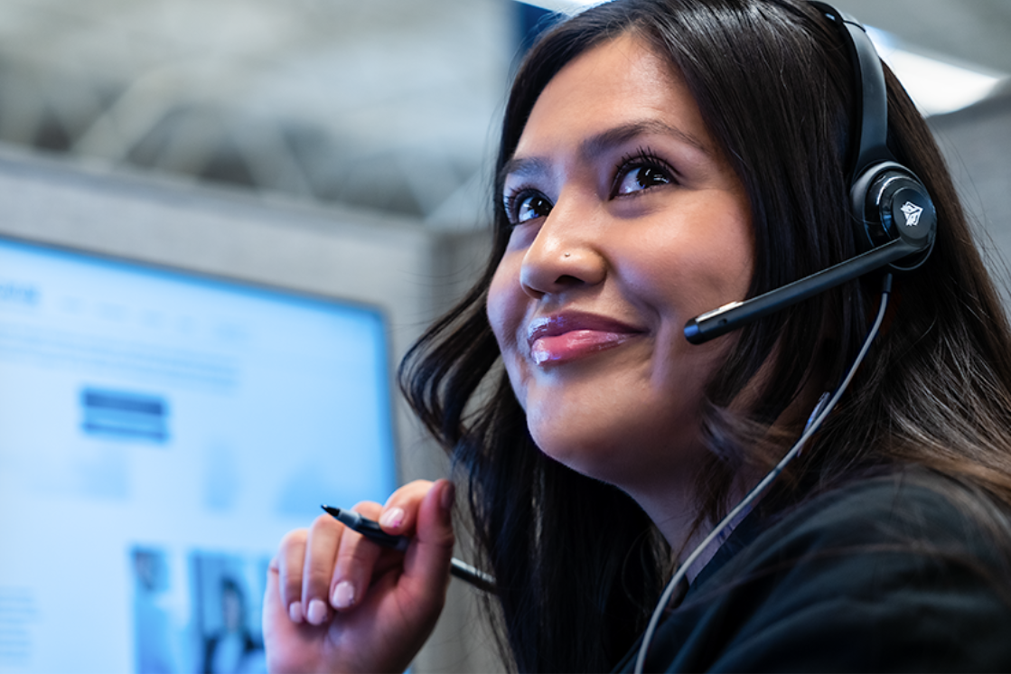 Technicians with her headset on, ready to assist an end user. Technicians with her headset on, ready to assist an end user.