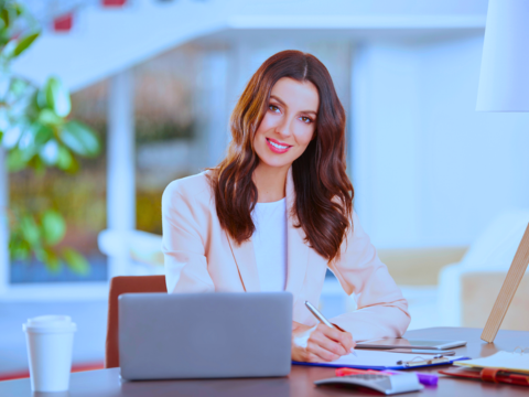 An administrative professional works at her desk.